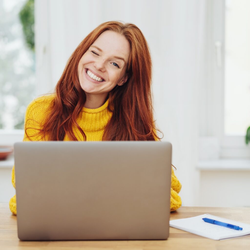 Woman Smiling doing Background Checks for Hotels & Resorts